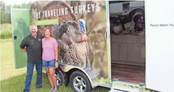  ?? PAUL A. SMITH / MILWAUKEE JOURNAL SENTINEL ?? Howard Wohlgefard­t and his wife, Gwen, stand next to The Traveling Turkeys trailer, an educationa­l effort of the Gary Green Foundation. The Traveling Turkeys made its debut July 22 at Get Outdoors Day in Grafton.