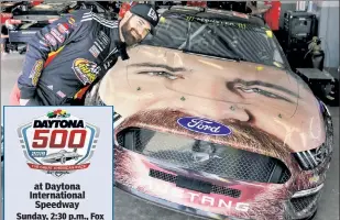  ?? AP ?? FACE RACE: Corey LaJoie, one of eight rookies in the field Sunday for the Daytona 500, shows off his Ford Mustang with his likeness plastered on the hood.