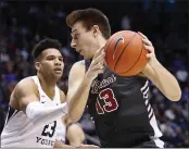  ?? GEORGE FREY — THE ASSOCIATED PRESS ?? Santa Clara’s Josip Vrankic, who led the Broncos with 28 points, works against BYU’s Yoeli Childs on Thursday.