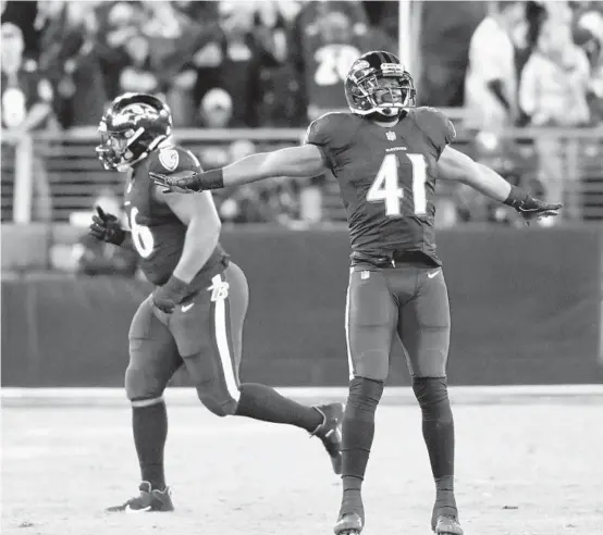  ?? PHOTOS BY KARL MERTON FERRON/BALTIMORE SUN ?? Ravens defensive back Anthony Levine reacts to the Indianapol­is Colts’ missed field goal as time expires on Monday night.