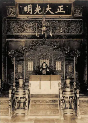  ??  ?? In 1917, Zhang Xun, a warlord loyal to the Qing court, restored the abdicated emperor Puyi to the throne for 11 days. The picture shows the 12-year-old Puyi sitting on the throne in the Palace of Heavenly Purity in the Forbidden City.