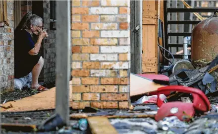  ?? Godofredo A. Vásquez / Staff photograph­er ?? Linda Drounette, 78, drinks a cup of coffee while looking out at the debris left after Hurricane Laura blew through Lake Charles, La., on Aug. 27. For storms that reached the U.S., Laura was the strongest at landfall.