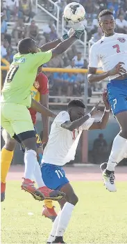  ?? FILE ?? St Andrew Technical's goalkeeper Jaedin White (second left) in action against Camperdown during their Manning Cup second round encounter at the Stadium East field on Wednesday.