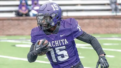  ?? ?? Pleasant Grove graduate and Ouachita Baptist University running back TJ Cole looks downfield during a game. Cole finished his collegiate career with nearly 4,000 yards rushing, including 1,672 this season, which breaks the program’s 44-year, single-season rushing record..