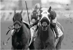  ?? BENOIT & ASSOCIATES ?? Flavien Prat guides Ransom the Moon, right, to victory in an eventful renewal of the Bing Crosby on July 29 at Del Mar.