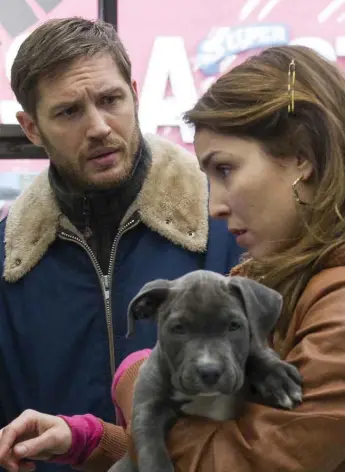  ?? BARRY WETCHER/THE ASSOCIATED PRESS ?? Tom Hardy and Noomi Rapace star in The Drop, with a puppy whose ownership forms a subplot.