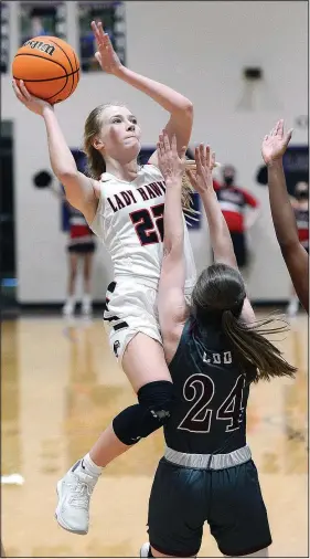  ?? (Special to NWA Democrat-Gazette/Brian Sanderford) ?? Pea Ridge Lady Blackhawk senior Blakelee Winn (22) shoots as Morrilton’s Allison Dunlap (24) defends on Saturday in Ozark during the 4A North Regional tournament championsh­ip game. Morrilton won the game 46-39 in overtime.