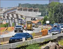  ?? HYOSUB SHIN / HYOSUB.SHIN@AJC.COM ?? Work takes place last August at the site of the I-285 interchang­e at Ga. 400 in Sandy Springs. Sen. Beach says we need block-grant infrastruc­ture dollars to the states for projects.