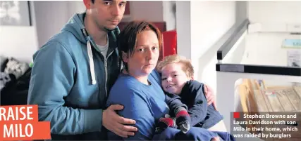  ??  ?? Stephen Browne and Laura Davidson with son Milo in their home, which was raided by burglars