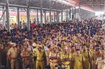  ?? PTI ?? Police stand guard at the Cochin Internatio­nal Airport after women’s rights activist Trupti Desai (unseen) arrived to visit the Sabarimala temple, in Kochi, yesterday. Desai was forced to stay inside the Airport as hundreds of protesters blocked her way at the arrival gate.