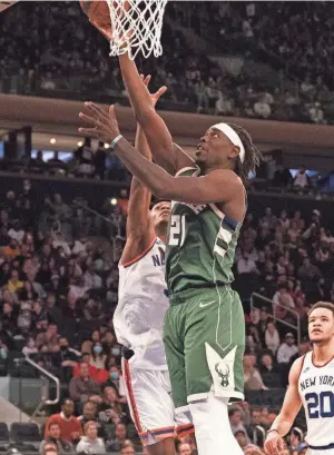  ?? FISHER/USA TODAY SPORTS
GREGORY ?? Bucks point guard Jrue Holiday shoots a layup against the Knicks on Sunday.