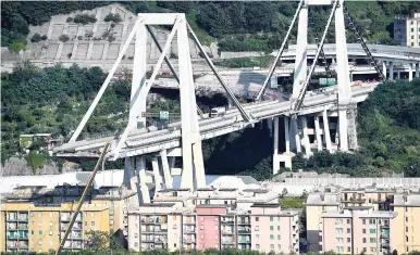  ?? AP ?? A view of the partially collapsed Morandi highway bridge in Genoa, Italy, yesterday. The unofficial death toll in Tuesday’s collapse rose to 43 Saturday.