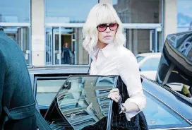  ?? BY JONATHAN PRIME, FOCUS FEATURES/AP] [PHOTO ?? This image released by Focus Features shows Charlize Theron in “Atomic Blonde.”