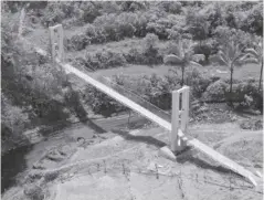  ?? ?? The Supanga Hanging Bridge in Barangay Supanga, Calinog, Iloilo is one of the six Agroforest­ry Support Facilities funded by the Japan Internatio­nal Cooperatio­n Agency through the Department of Environmen­t and Natural Resources in the town.