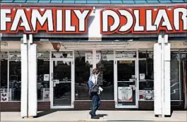  ?? RICK WILKING/REUTERS 2009 ?? Family Dollar approved a “poison pill” to deter hostile takeovers after Carl Icahn reported a 9.39 percent stake in the chain. He said he may push a merger with rival Dollar General.