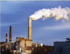  ??  ?? NEW HAMPSHIRE: In this file photo, a plume of steam billows from the coal-fired Merrimack Station in Bow, New Hampshire.—AP