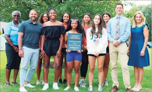  ?? Contribute­d / CHSCA ?? The Danbury girls track team was honored as the state's Team of the Year by the Connecticu­t High School Coaches Associatio­n. From left, CHSCA President Deb Petruzzell­o, assistant coach Briana Gilliard, Kimberleig­h Williams, Corrine Whelchel, Danbury Head Coach Nick Fraticelli, and Barbara Hedden, CHSCA Girls’ Outdoor Track & Field Committee Chairperso­n. Back row from left, Alanna Smith, Stephanie Quieroz, Victoria Batista and Larissa Batista.