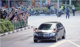  ?? LYNN BO BO/EPA-EFE ?? A motorcade carrying North Korean leader Kim Jong Un travels through the streets of Singapore on Sunday.