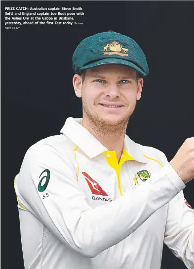  ?? Picture: ?? PRIZE CATCH: Australian captain Steve Smith (left) and England captain Joe Root pose with the Ashes Urn at the Gabba in Brisbane, yesterday, ahead of the first Test today. DAVE HUNT