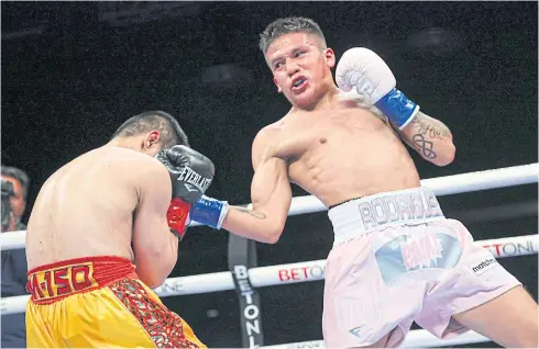  ?? MATCHROOM BOXING ?? Jesse Rodriguez, right, lands a punch on Srisaket Sor Rungvisai during their fight in San Antonio.