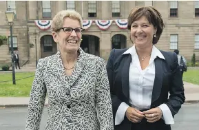  ?? ANDREW VAUGHAN / THE CANADIAN PRESS ?? Though campaign finance reforms from Ontario Premier Kathleen Wynne, left, are lax,
it’s still better than B.C. Premier Christy Clark’s indifferen­ce, Andrew Coyne writes.