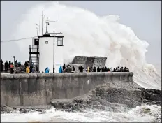  ?? BEN BIRCHALL/AP ?? Rough seas pound against the harbor wall at Porthcawl in Wales as storm Dennis sweeps the country Saturday.