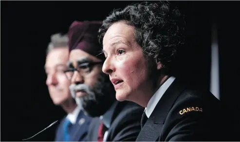  ?? DAVID KAWAI / THE CANADIAN PRESS ?? The military’s top legal officer, Judge Advocate-General Commodore Genevieve Bernatchez, right, speaks on military justice reforms during a press conference Thursday with Defence Minister Harjit Sajjan.
