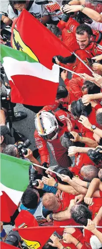  ?? MARK THOMPSON/GETTY IMAGES ?? Sebastian Vettel gets a hero’s welcome in Montreal after winning the Canadian Grand Prix on Sunday.