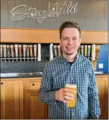  ?? JOURNAL-CONSTITUTI­ON BOB TOWNSEND FOR THE ATLANTA ?? Chris Elliot is chief brewing officer at Wild Leap Brew Co. in LaGrange.