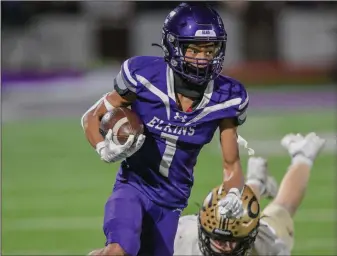  ?? (NWA Democrat Gazette/Caleb Grieger) ?? Elkins’ James Townsend (above) runs the ball after a catch in the second quarter against Clinton on Nov. 10 at John Bunch Jr. Memorial Stadium in Elkins. The Elks play at Central Arkansas Christian on Friday in the Class 4A quarterfin­als.