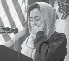  ?? CHRISTINE TANNOUS/INDYSTAR ?? Afghan refugee Nahid Sharifi cries during a news conference Nov. 23 at the Camp Atterbury Welcome Center in Edinburgh, Ind.