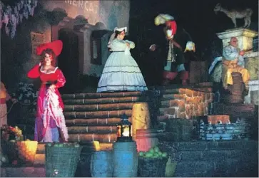  ?? Kari Rene Hall Los Angeles Times ?? THIS SCENE of women being offered up for auction in the Pirates of the Caribbean ride at Anaheim’s Disneyland will be replaced by one that depicts pirates forcing townsfolk to give up their valuables.