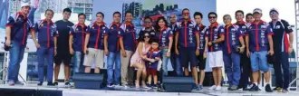  ?? BMW Car Club of the Philippine­s members with 14th Bimmerfest Philippine­s 2017 program host Kriz Nuqui (center). ??