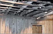  ?? / Doug Walker ?? A heater is believed to have started the fire that gutted the interior roofing of the Johns Mountain wildlife check station.