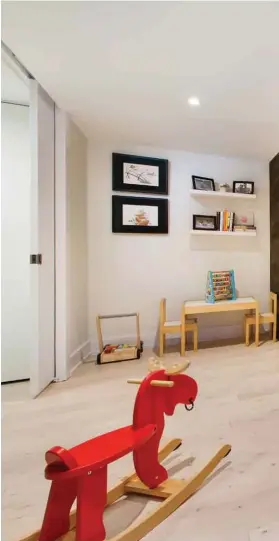  ??  ?? Architect Jay Lim designed this modern playhouse to encourage his three small kids to relocate from the living room to the basement. It’s made with plywood and stained pine flooring — scraps left over when the house was built Lim calls the pod a...