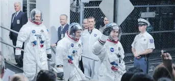  ??  ?? Corey Stoll, left, as Buzz Aldrin, Lukas Haas as Mike Collins and Ryan Gosling as Neil Armstrong star in First Man.