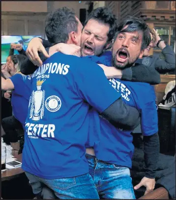  ??  ?? Leicester City fans react in a pub in the city after Eden Hazard scores the equalising goal against Tottenham