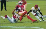  ?? ROSS D. FRANKLIN — THE ASSOCIATED PRESS ?? San Francisco 49ers wide receiver Brandon Aiyuk (11) is tackled by Washington Football Team cornerback Jimmy Moreland and free safety Deshazor Everett (22) during the first half Sunday in Glendale, Ariz.