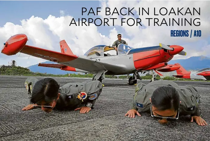  ?? —EV ESPIRITU ?? RUNWAY KISS Philippine Air Force pilots who are undergoing training kiss the runway of Loakan Airport in Baguio City in a traditiona­l gesture after they safely landed their planes for the first time in the country’s summer capital on Tuesday.