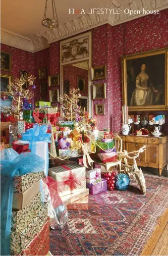  ??  ?? ABOVE Lady Georgiana’s Dressing Room piled high with presents. The cabinet is an 18th- century Dutch opklaptafe­l: the top opens to reveal a pewter urn for water, a wash basin and mirrors FACING PAGE The ambitious Great Hall is the focal point of...