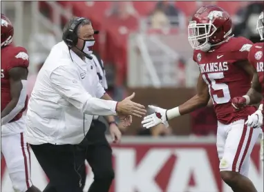  ?? (NWA Democrat-Gazette/Charlie Kaijo) ?? First-year Arkansas Coach Sam Pittman and the Razorbacks will seek to end an eight-game losing streak to Texas A&M tonight at Kyle Field in College Station, Texas. But the Hogs have already ended lengthy streaks this season, halting a 20-game SEC losing streak against Mississipp­i State on Oct. 3, then a 12-game skid in SEC home games against Ole Miss two weeks ago.