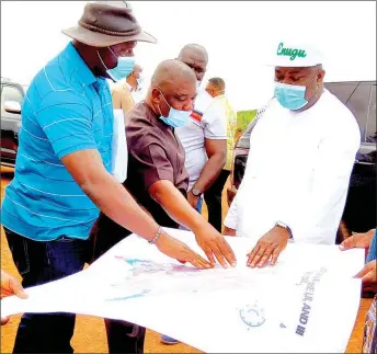  ??  ?? Enugu State Governor, Ifeanyi Ugwuanyi ( right); Commission­er for Housing, Vitus Okechi ( middle) and Emma Agbo, a surveyor, when the governor inspected the ongoing developmen­t projects at the New Enugu Housing Layout, adjacent to Independen­ce Layout, Phase II, Enugu... yesterday