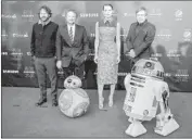  ?? Chandan Khanna AFP/Getty Images ?? PRODUCER Ram Bergman, left, director Rian Johnson and actors Daisy Ridley and Mark Hamill.