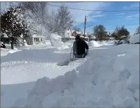  ?? (AP/Bridget Haslinger) ?? Martin Haslinger uses a snowblower outside his home Saturday in Buffalo, N.Y., following a lake-effect snowstorm. More photos at arkansason­line.com/1120nystor­m/.