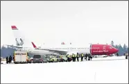  ??  ?? Emergency services at the scene of an aircraft that landed after a bomb threat, in Stockholm on Feb 7. Norwegian Air says one of its planesboun­d for Nice, southern France was forced to return to Stockholm soon after taking off for security reasons after the airline received a bombthreat. (AP)