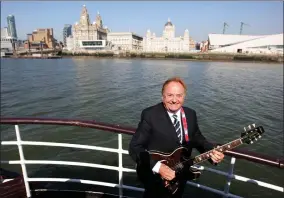  ?? AP PHOTO BY DAVE THOMPSON/PA ?? This April 20, 2009 file photo shows Gerry Marsden on board the Mersey ferry. Gerry Marsden, the British singer and lead singer of Gerry and the Pacemakers, who was instrument­al in turning a song from the Rodgers and Hammerstei­n musical “Carousel” into one of the great anthems in the world of football, has died. He was 78.