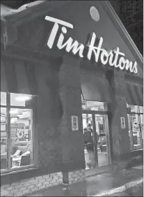  ?? CP PHOTO ?? After months of warring with franchisee­s over everything from Ontario’s minimum wage hike to cash register outages and delays in supply deliveries, Tim Hortons is ready to make amends.