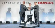  ??  ?? General Motors executive vice-president global product developmen­t Mark Reuss (left), Michigan lieutenant-governor Brian Calley and Honda CEO North American region and president Honda North America Toshiaki Mikoshiba at the announceme­nt.