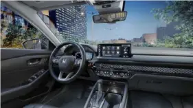  ?? ?? The interior of the 2024 Honda Accord Hybrid Sport looks not unlike this Touring model from 2023. The return of the gearshift is a welcome developmen­t.