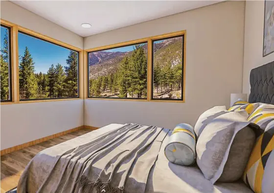  ?? Clear Creek Tahoe ?? Above: This bedroom features wood-framed windows that frame view of the mountainou­s surroundin­gs. Below left: The primary suite includes a spa bathroom with a soaking tub set beneath picture windows. Below right: Clear Creek Tahoe is a real estate developmen­t on the Carson Range, convenient­ly located just 20 minutes from South Lake Tahoe and Incline Village and 35 minutes from Reno/Tahoe airport.